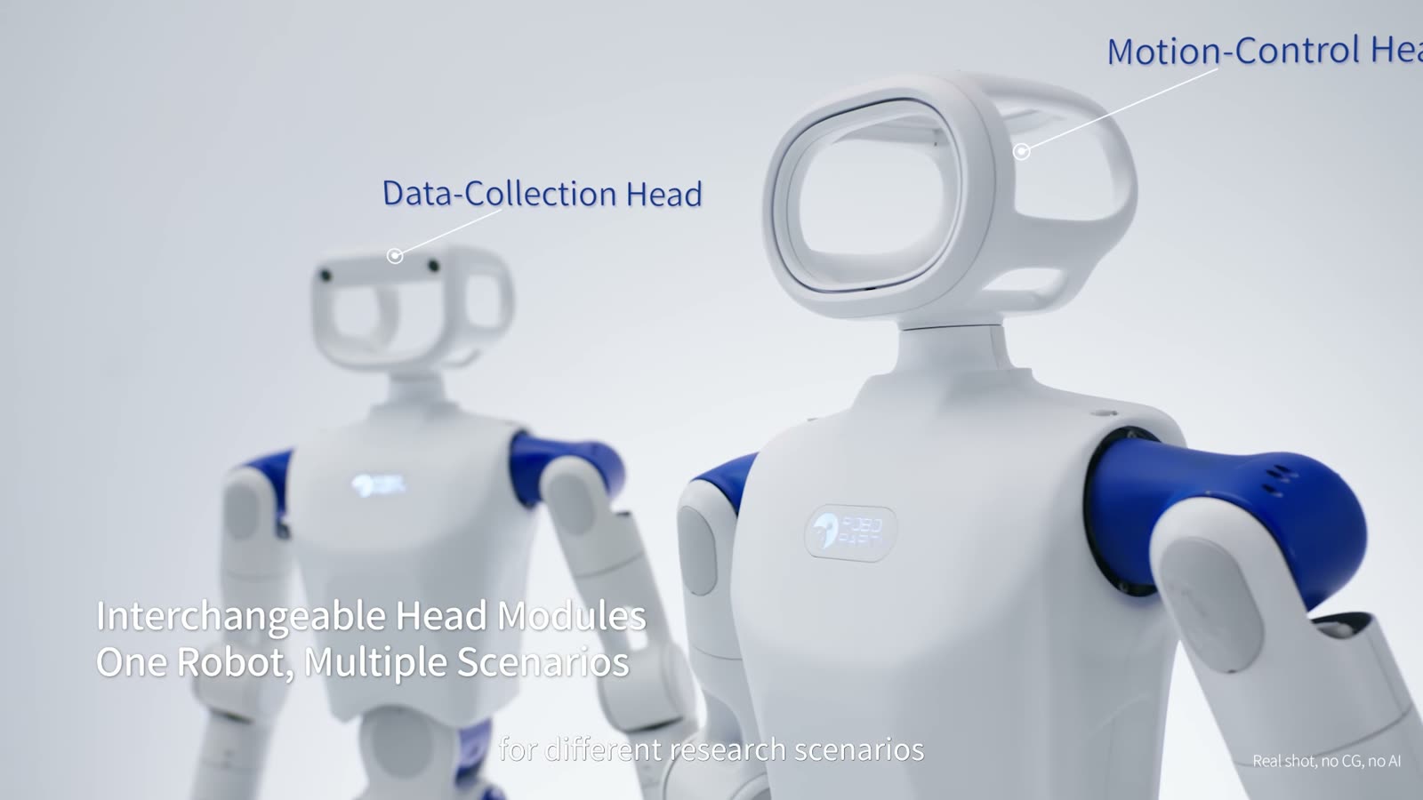 Two RP1 robots side by side wearing different heads, labelled Data-Collection Head and Motion-Control Head