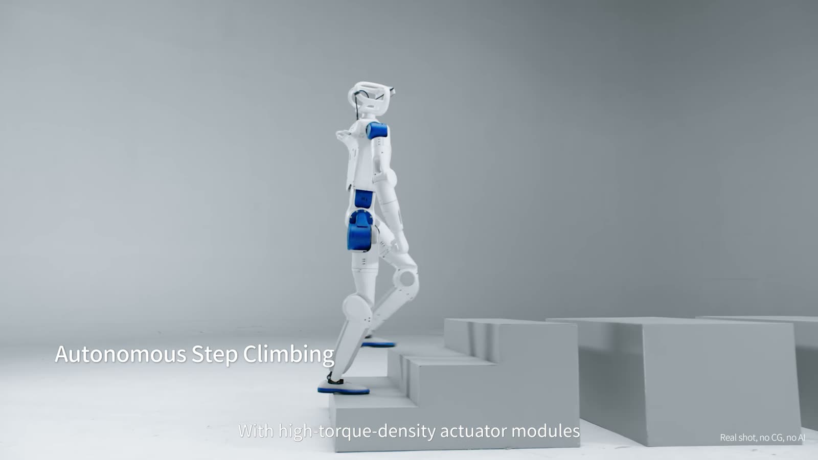 The RP1 walking up a set of grey steps in a studio, under an on-screen label reading Autonomous Step Climbing